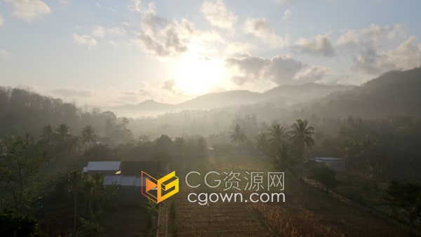 无人机拍摄笼罩薄雾农村农场山上美丽日出实拍视频素材4K分辨率