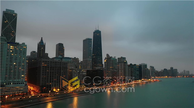 黄昏时光倒流城市高楼大厦湖边交通车辆灯光流动航拍实拍视频下载